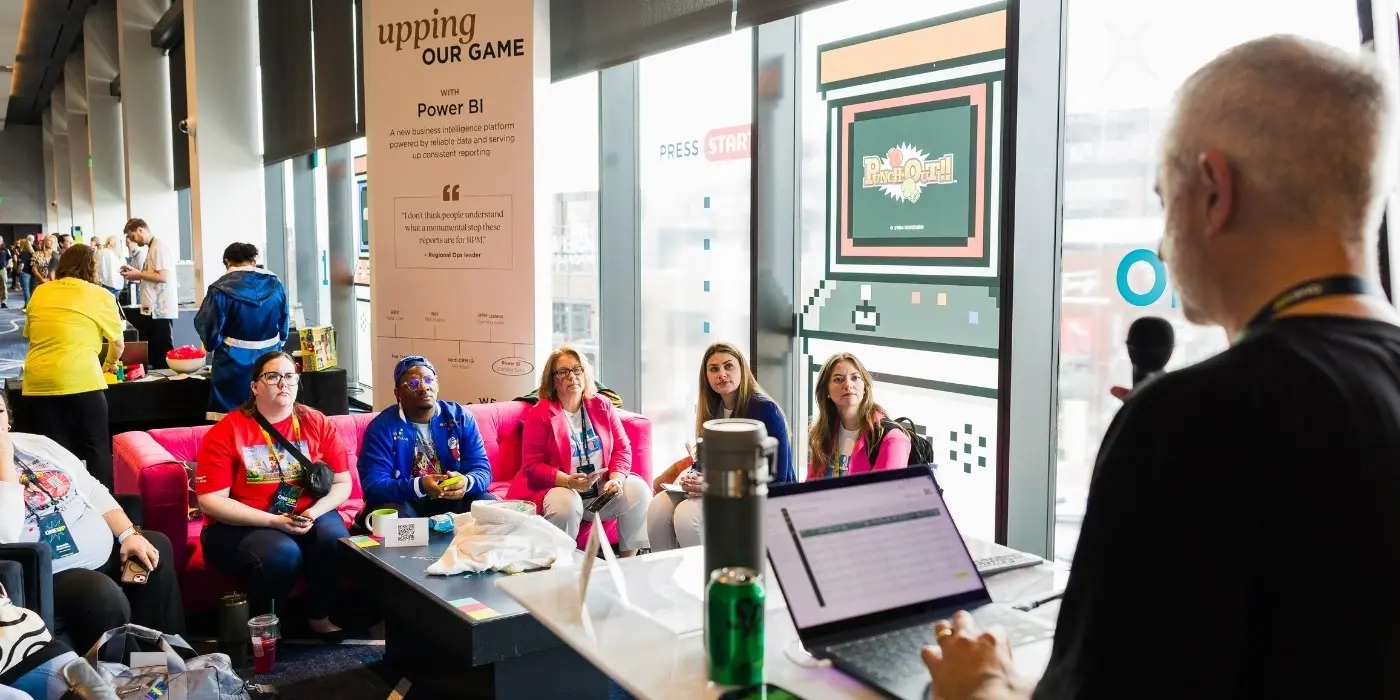 Attendees engaged in a breakout session at a corporate conference