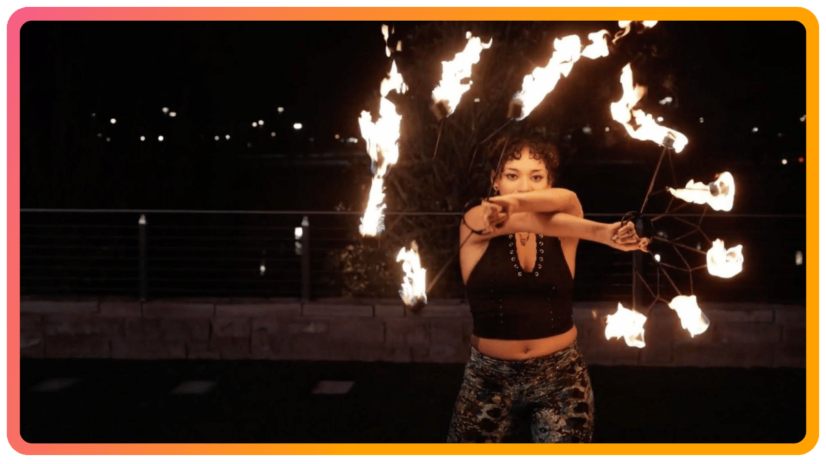 Fire dancer performing outdoors at a corporate event