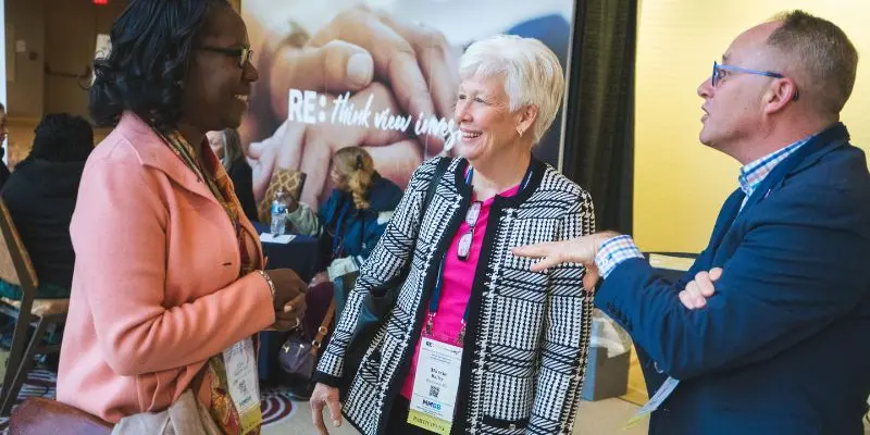 Attendees networking at a corporate conference